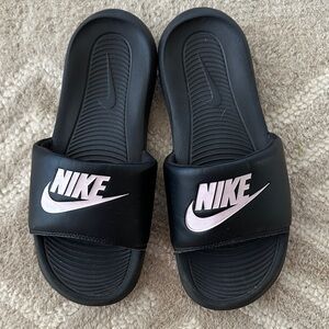 Nike slides with pink logo